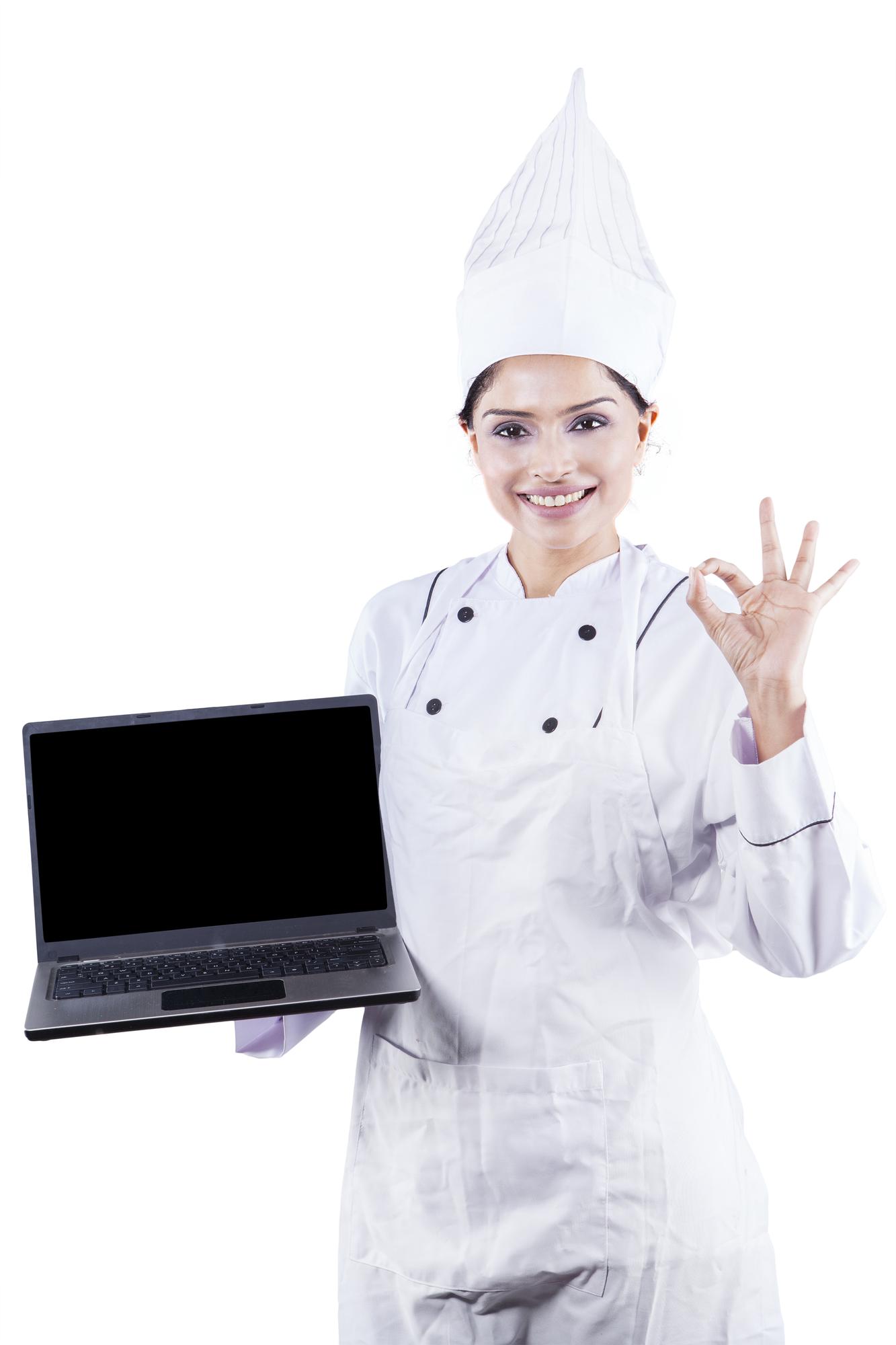 Chef teaching an online cooking class in a bright kitchen